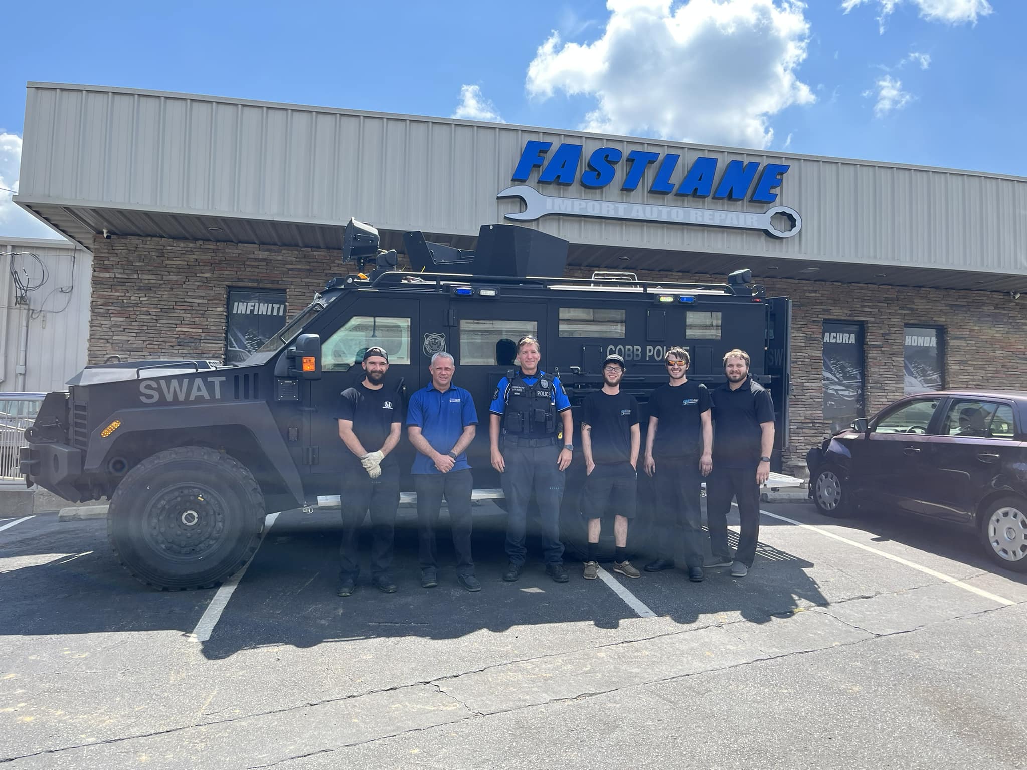 Fastlane Import Auto Repair team outside the shop